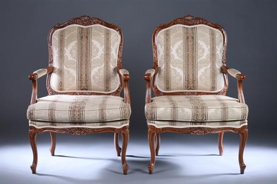 Appraisal: PAIR LOUIS XV STYLE CARVED FRUITWOOD FAUTEUILS late th century