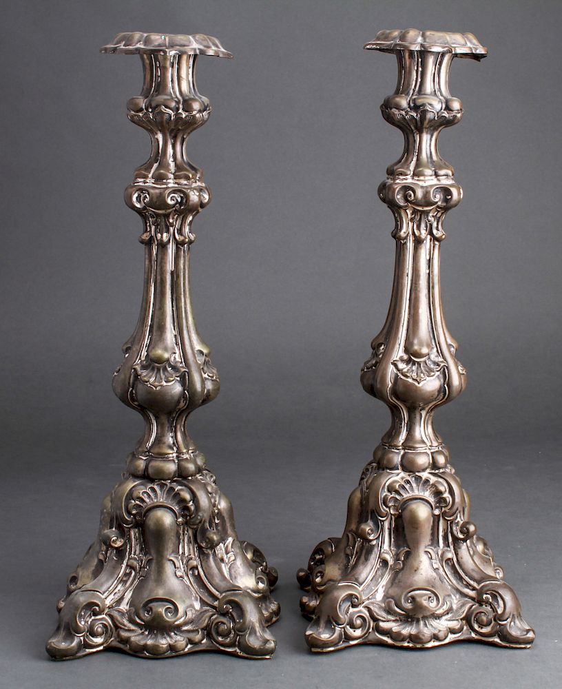 Appraisal: Baroque Style Silver-Plate Repousse Candlesticks Baroque style silver-plate repousse candlesticks