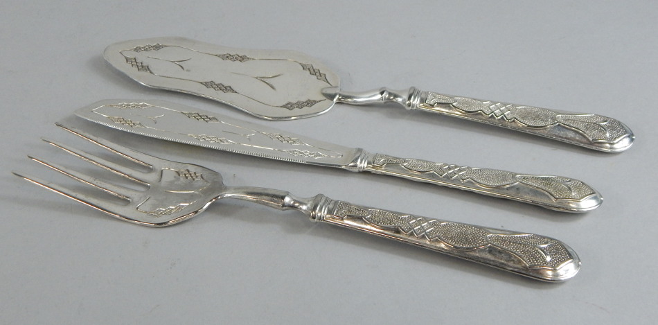 Appraisal: A Continental silver plated three piece fish serving set with