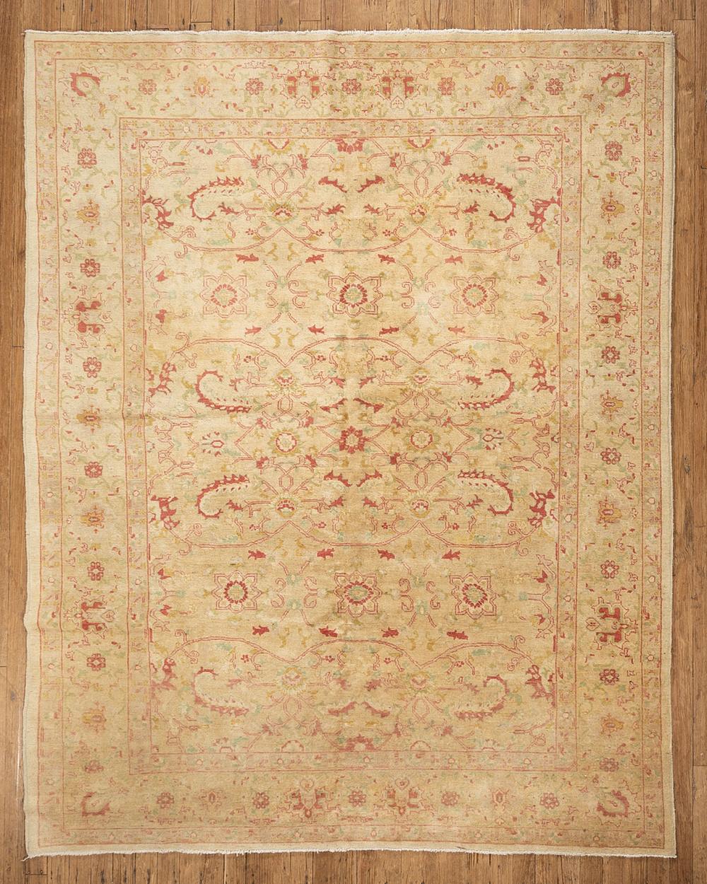 Appraisal: Oushak Rug khaki ground floral design in rose blue green