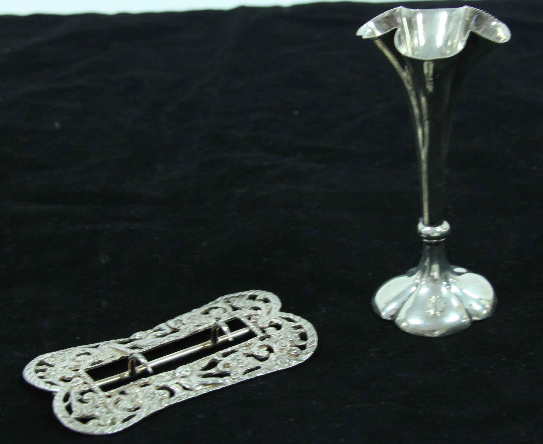 Appraisal: A silver posy holder London weighted and a silver buckle