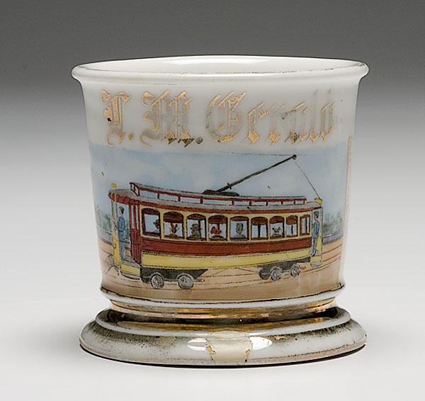 Appraisal: TROLLEY CONDUCTOR'S OCCUPATIONAL SHAVING MUG porcelain with electric trolley Limoges