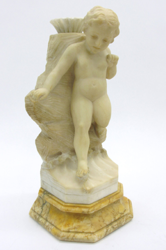 Appraisal: ALABASTER FIGURAL CUPID SCULPTURE ivory color the figure standing against