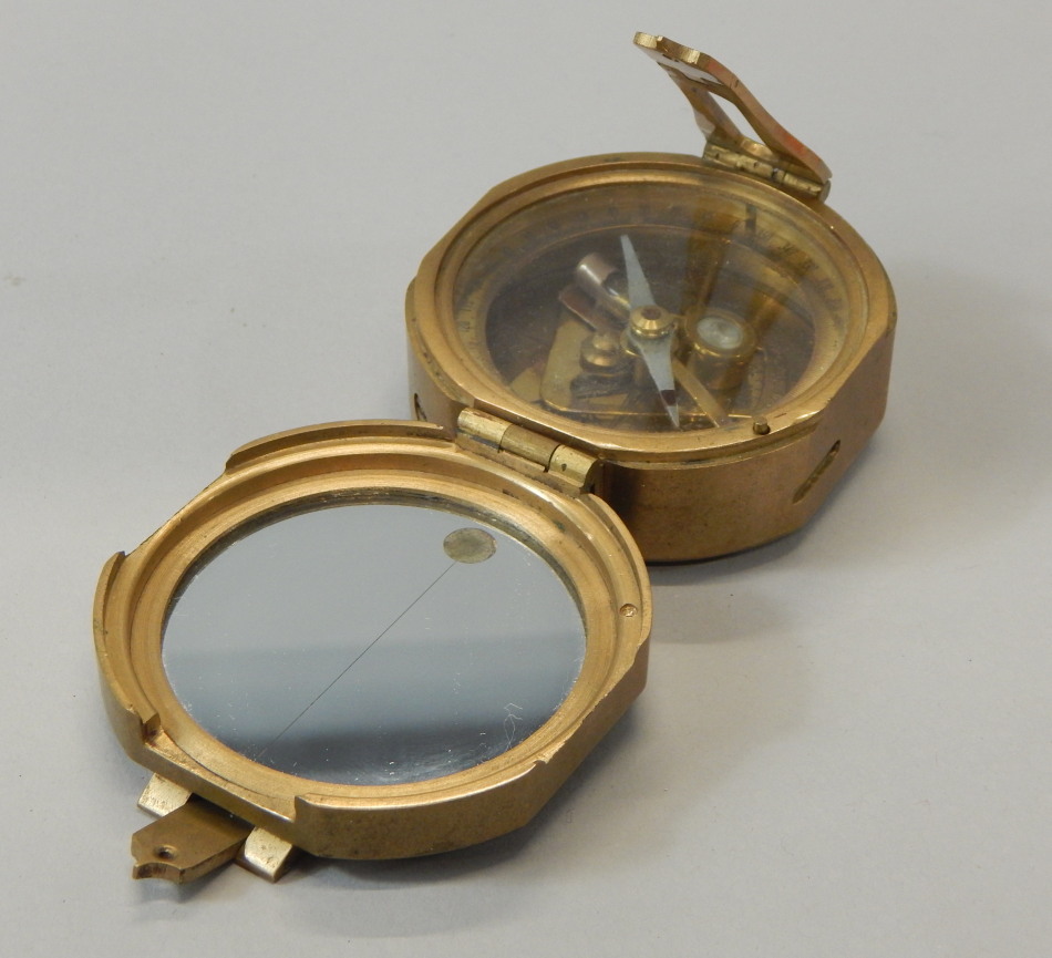 Appraisal: A reproduction brass nautical compass cm wide