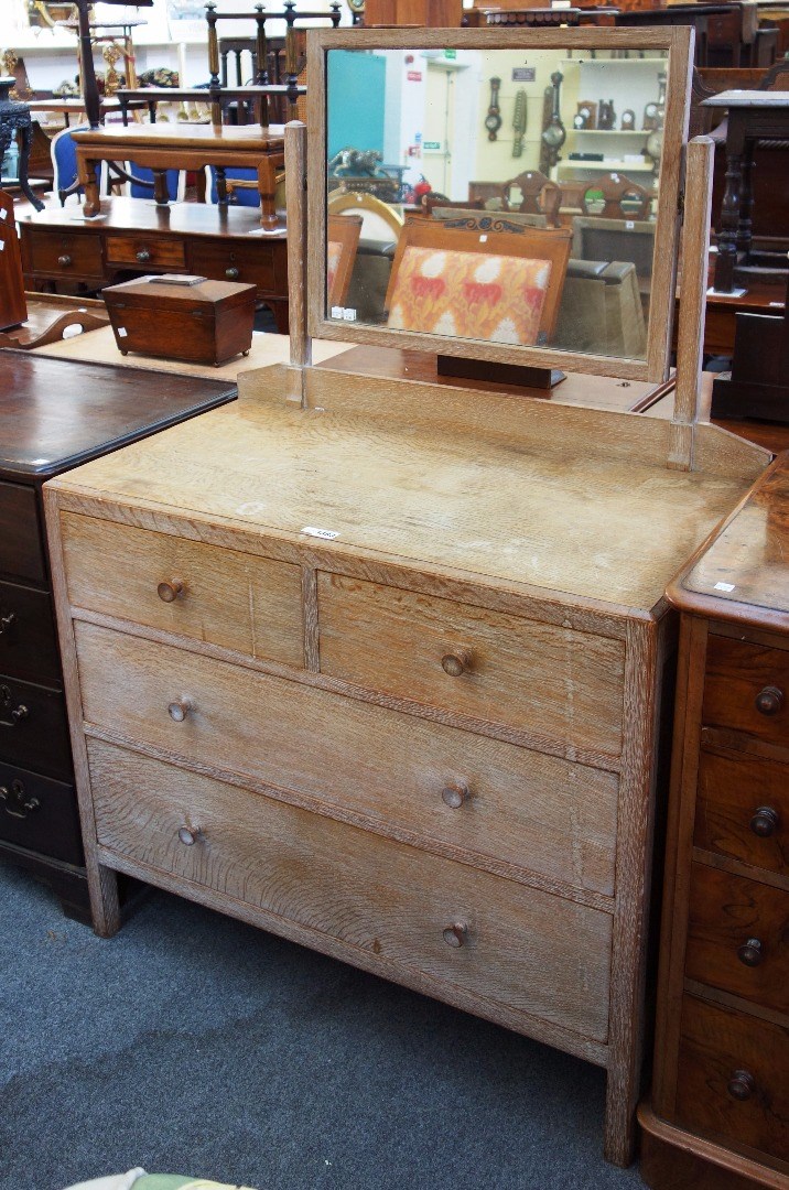 Appraisal: A th century limed oak dressing table with swing mirror