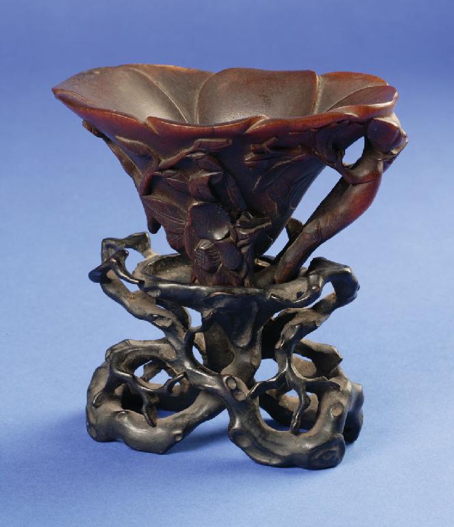 Appraisal: A CHINESE RHINOCEROS HORN LIBATION CUP with a shallow bowl