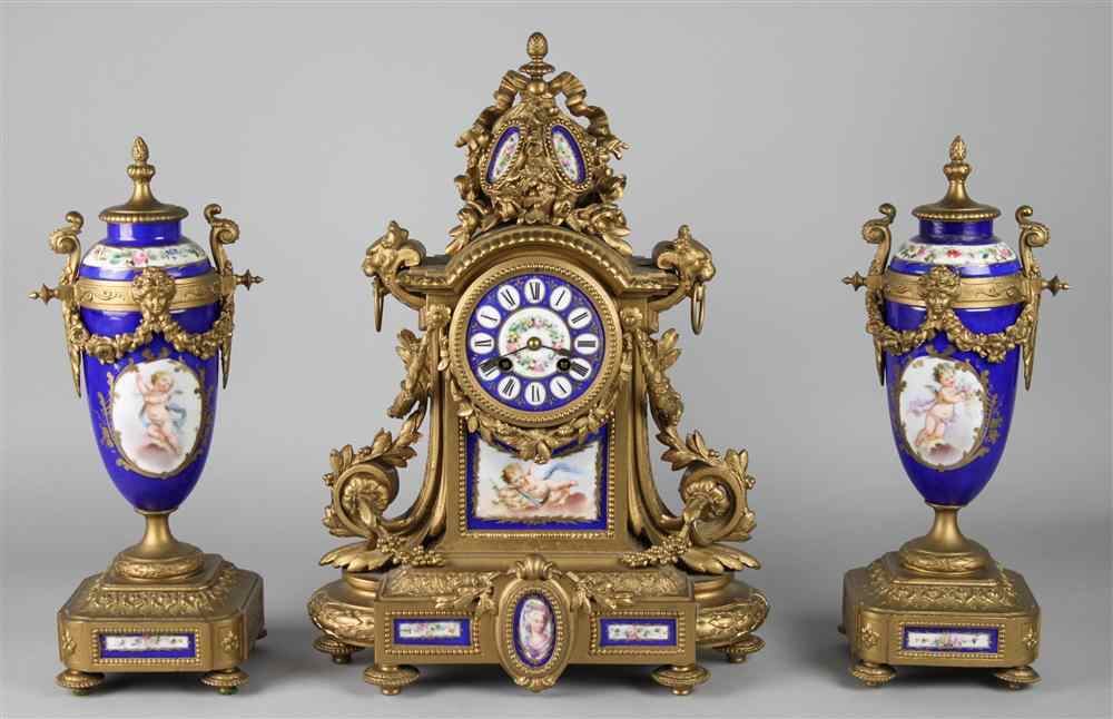 Appraisal: LOUIS XVI STYLE GILT BRONZE AND PORCELAIN CLOCK GARNITURE early