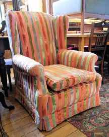 Appraisal: PINK AND STRIPED UPHOLSTERED WINGBACK ARMCHAIR