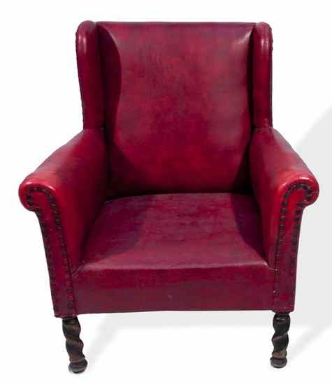 Appraisal: a leatherette upholstered wing armchair late th early th century