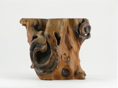 Appraisal: A large Chinese hardwood vase or brushpot formed from root-wood