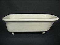 Appraisal: CAST IRON AND PORCELAIN DOLL BATH TUB The tub is