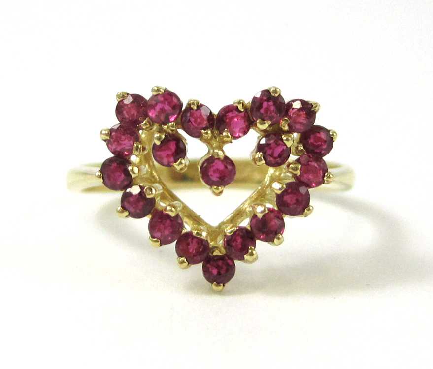 Appraisal: RUBY AND FOURTEEN KARAT GOLD HEART RING with round-cut red