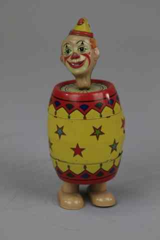 Appraisal: CLOWN IN BARREL WALKER Chein Co wind up lithographed tin