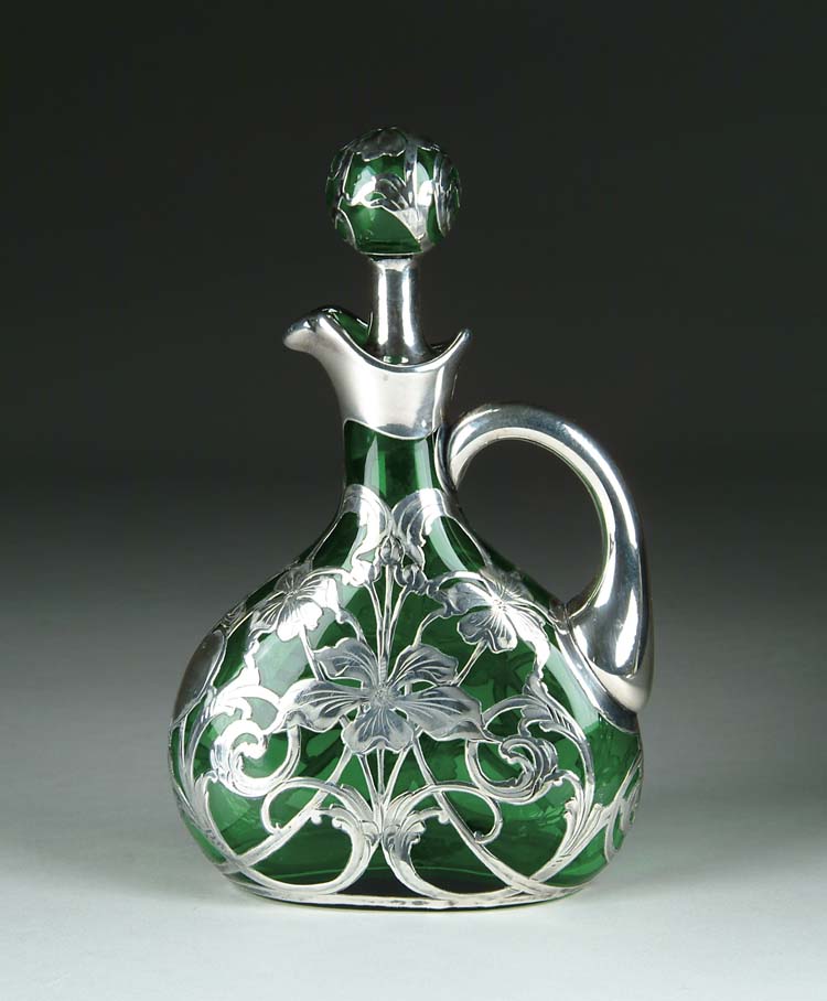 Appraisal: SILVER OVERLAY DECANTER Silver overlay decoration consists of flowers leaves