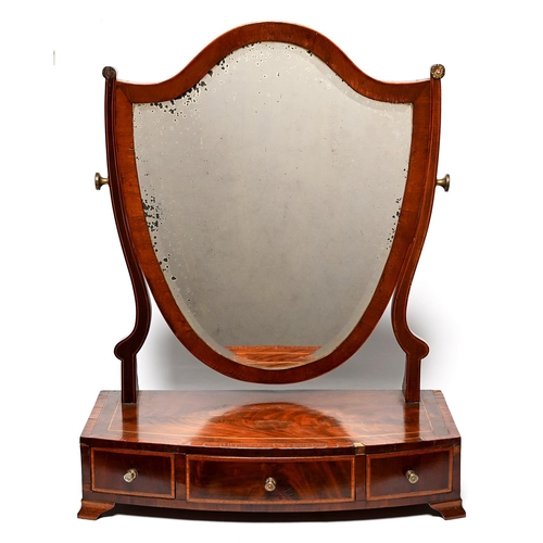 Appraisal: A Victorian mahogany dressing mirror with shield shaped plate the