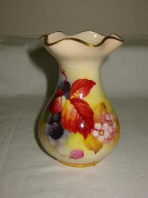 Appraisal: A ROYAL WORCESTER PORCELAIN VASE of bellied form with frilled