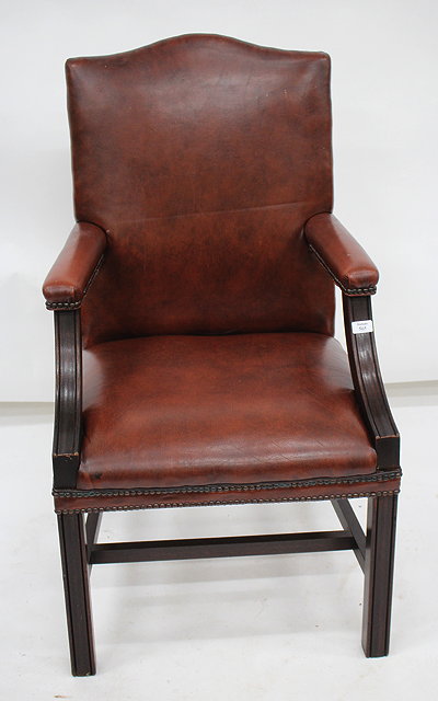 Appraisal: A HARDWOOD GAINSBOROUGH TYPE BROWN LEATHER UPHOLSTERED LIBRARY OPEN ARMCHAIR