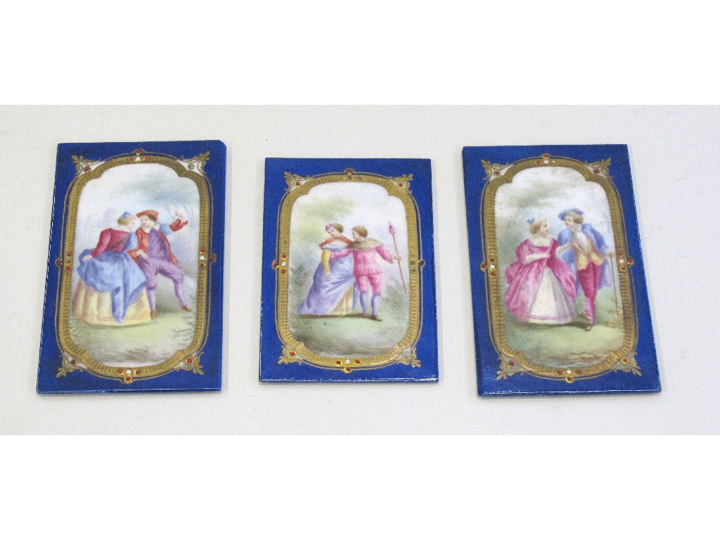 Appraisal: Three handpainted porcelain plaques each decorated with a courting couple