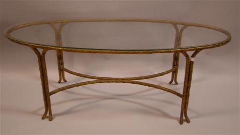 Appraisal: BASQUE FORMED OVAL GLASS TOP COFFEE TABLE the oval glass