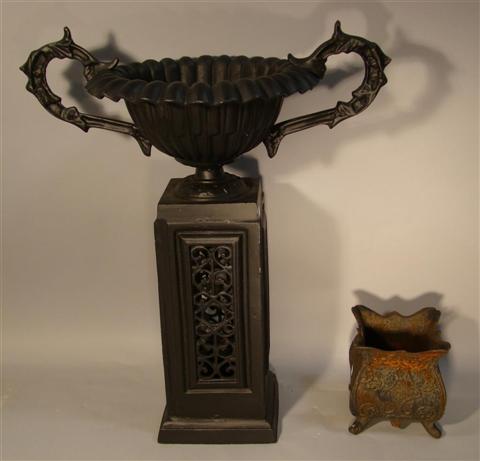 Appraisal: BLACK CAST IRON URN FORM PLANTER the planter of fluted