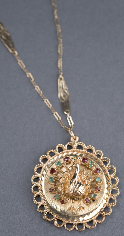 Appraisal: KT yellow gold peacock charm with rubies and emeralds and