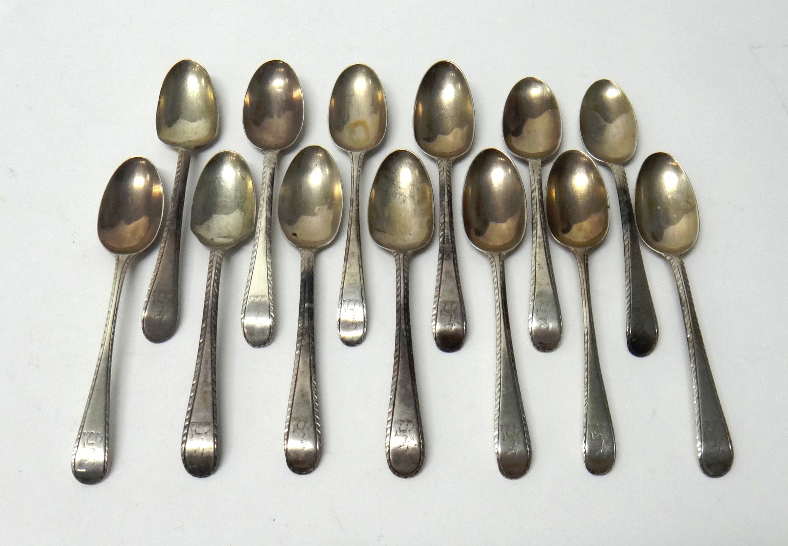 Appraisal: Thirteen George III silver teaspoons feather edged Old English pattern