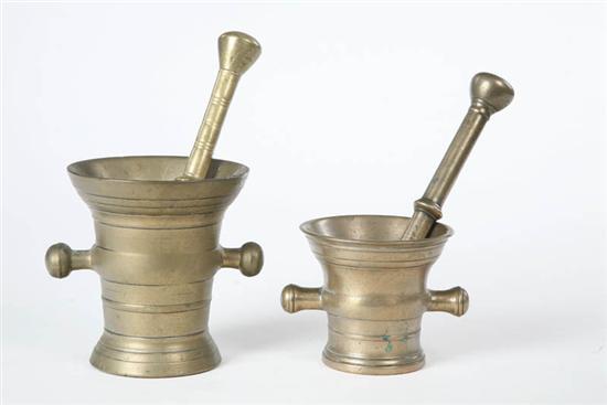 Appraisal: TWO BRASS MORTARS AND PESTLES Both of elongated form with