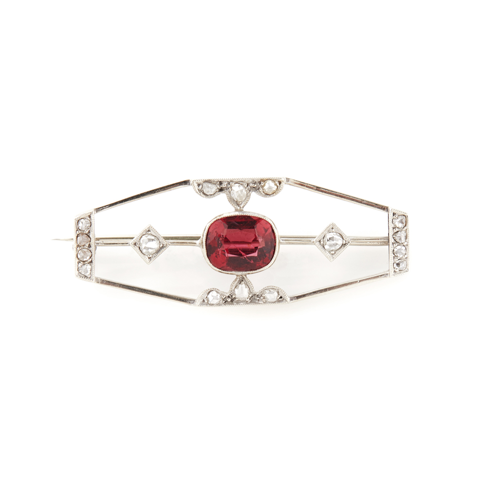 Appraisal: A ruby and diamond set brooch millegrain set with a