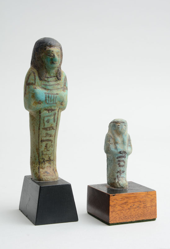 Appraisal: TWO EGYPTIAN TURQUOISE-GLAZED POTTERY USHBATI Each erect figure with crossed