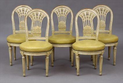 Appraisal: SET OF FIVE LOUIS XVI-STYLE CARVED AND IVORY-PAINTED CHAISES A