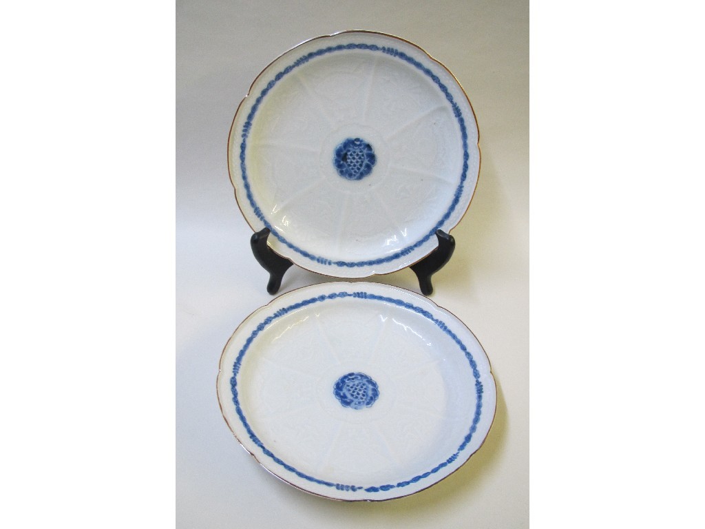 Appraisal: A pair of Chinese saucers with relief moulded panels of