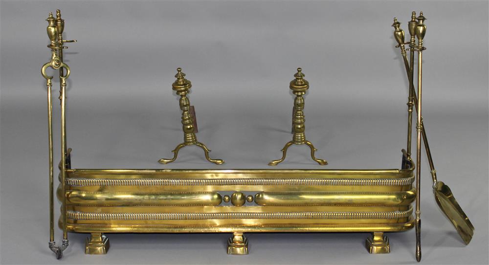 Appraisal: PAIR OF BRASS ANDIRONS WITH A BRASS HAMMERED FENDER AND