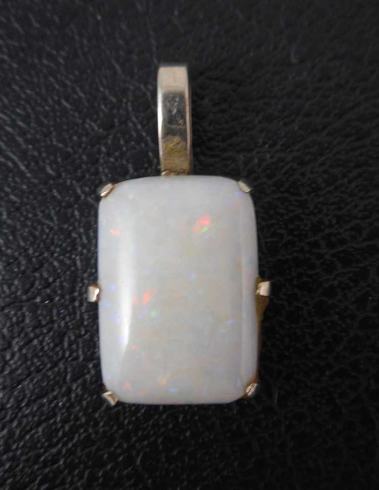 Appraisal: OPAL AND FOURTEEN KARAT WHITE GOLD PENDANT set with a