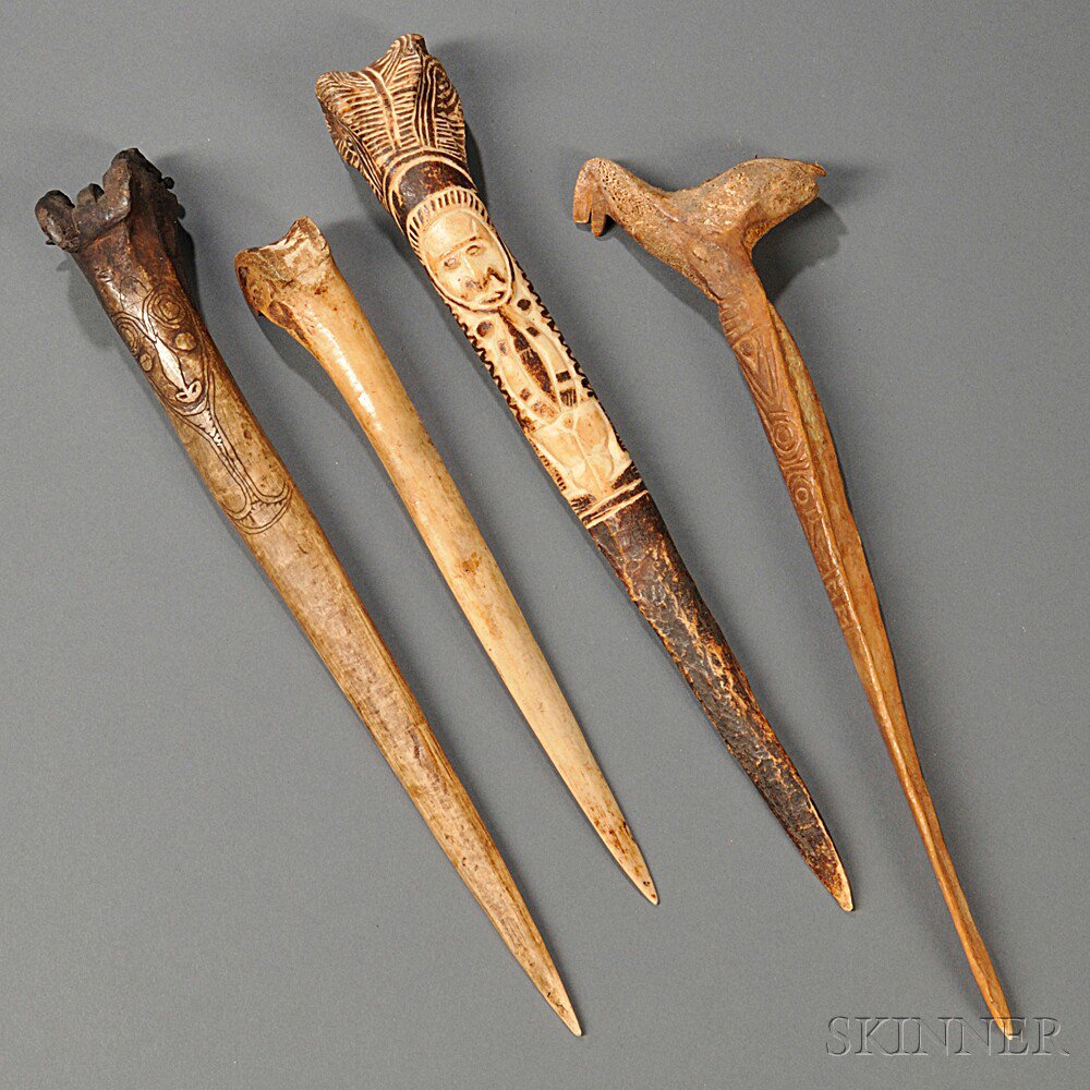 Appraisal: Four New Guinea Bone Daggers three with incised decoration lg