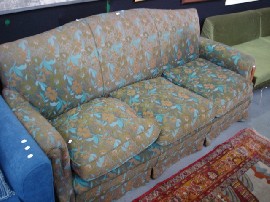 Appraisal: An upholstered three seater sofa