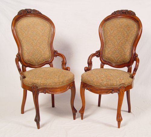 Appraisal: PAIR VICTORIAN CARVED ROSEWOOD SIDE CHAIRS Upholstered backs and seats