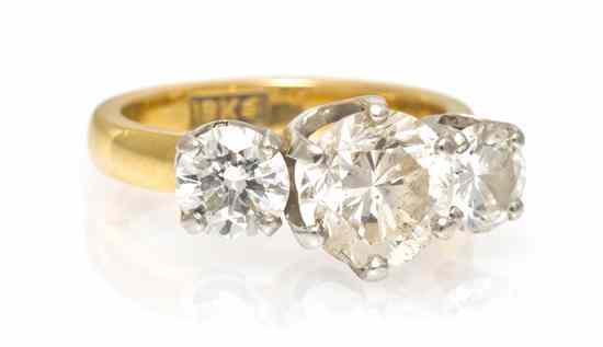 Appraisal: An Karat Gold and Three Stone Diamond Ring containing one