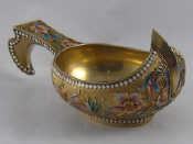 Appraisal: A Russian silver gilt kovsh with flowers in cloisonne shaded