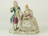 Appraisal: DOUBLE FIGURINE - Dresden figurine depicting a seated woman playing