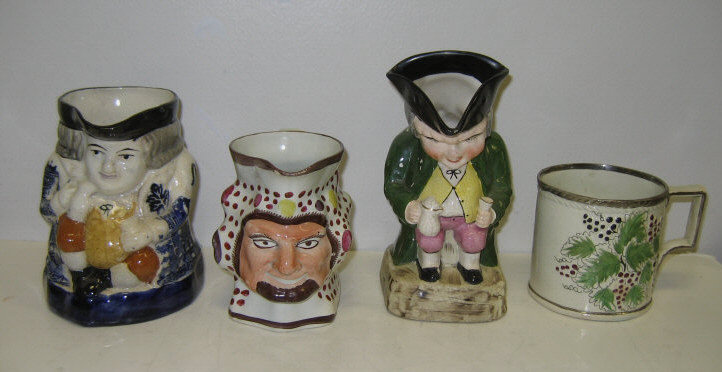 Appraisal: THREE ENGLISH FIGURAL JUGS AND MUG Pearlware and pottery polychrome