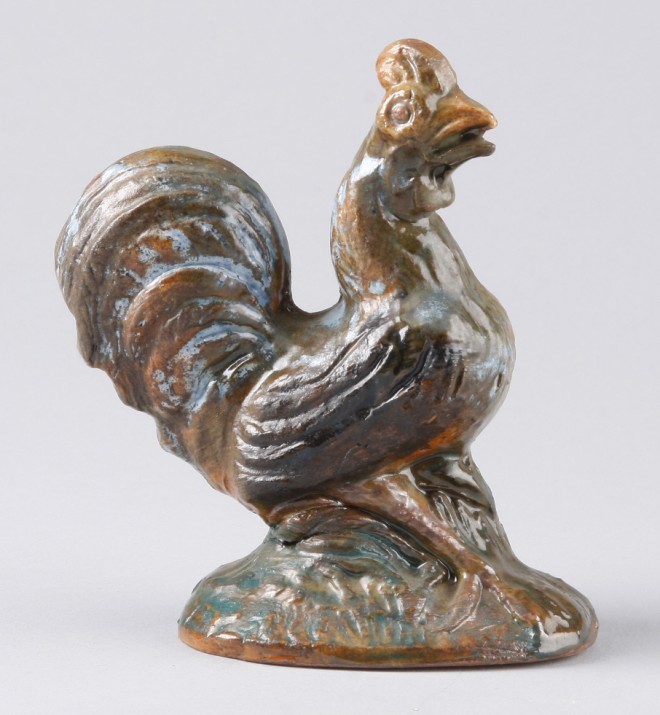 Appraisal: Redware rooster features multi-color glaze t marked on base By