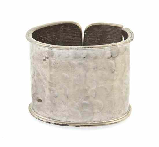 Appraisal: A Pauline Trigere Hammered Silvertone Hinged Cuff Stamped Trigere