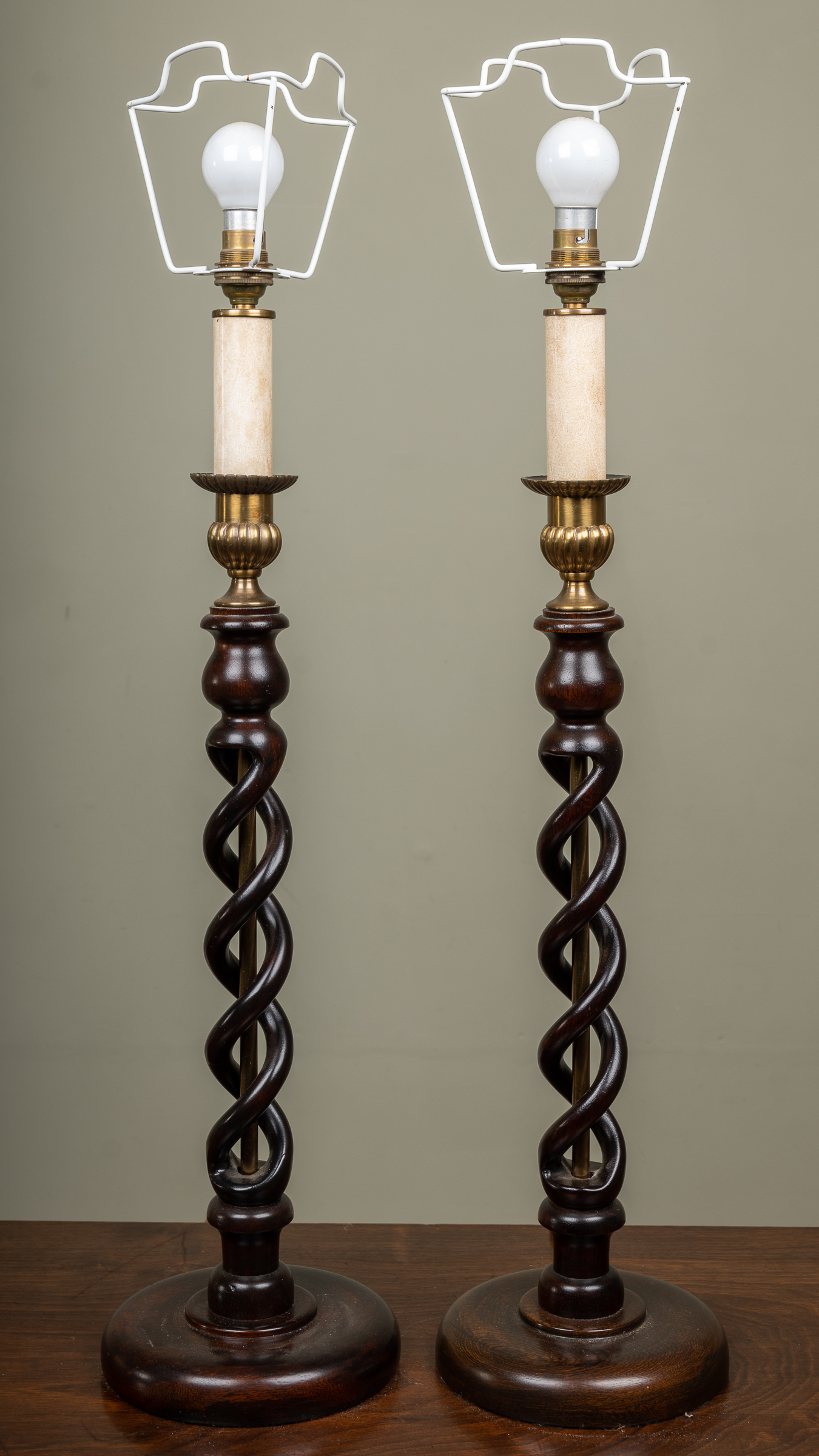 Appraisal: A pair of wooden table lamps with spiralling stems and