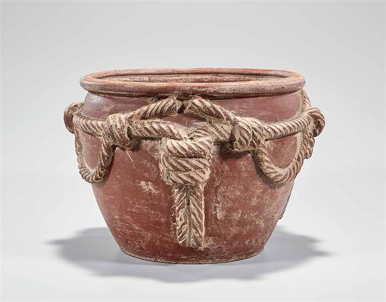 Appraisal: Chinese pottery jar with high relief enveloping rope design x