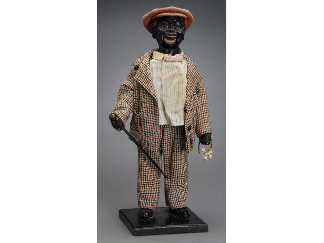 Appraisal: Black Man Clockwork Nodder Germany ca nodding molded paper mache