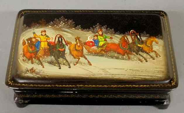 Appraisal: Finely decorated Russian lacquerware box c decorated with sledding scene