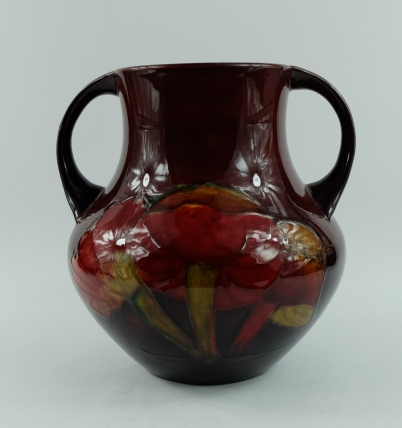 Appraisal: William Moorcroft two handled flambe vase decorated in the Claremont