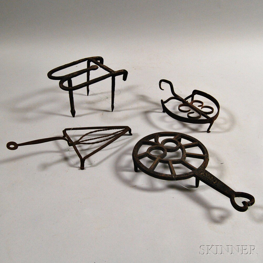 Appraisal: Four Mostly Wrought Iron Trivets America late th to th