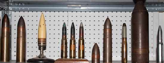 Appraisal: Twelve military shells for machine guns and cannon some mounted