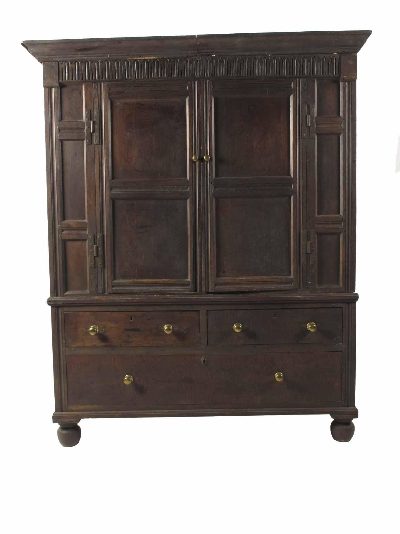 Appraisal: An th century panelled oak press cupboard